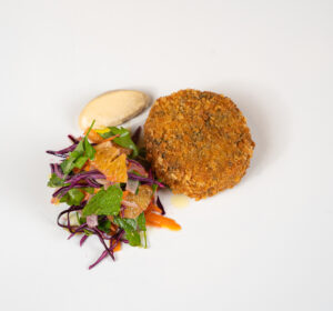 Chickpea and spinach coquettes, winter salad, tahini